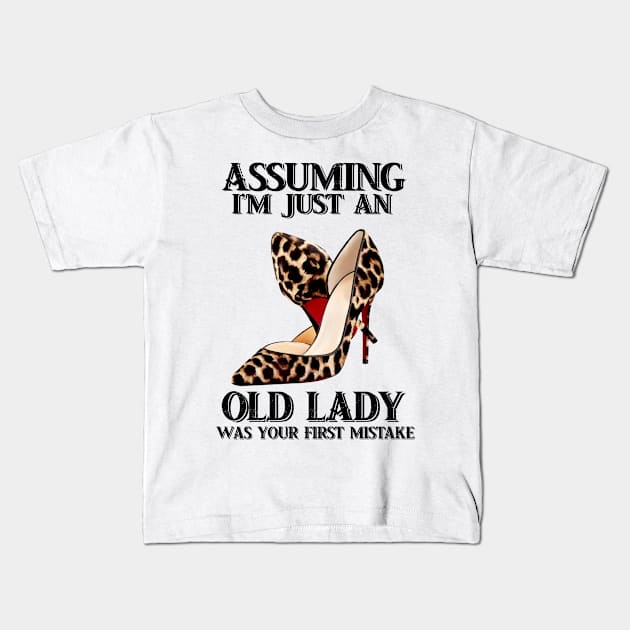 Assuming Im just an old lady was your fist mistake Kids T-Shirt by American Woman